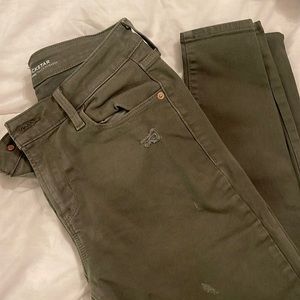 Distressed olive green jeans